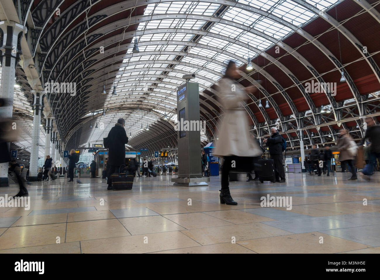 Commuters rushing to catch a train at Paddington station, London Stock Photo