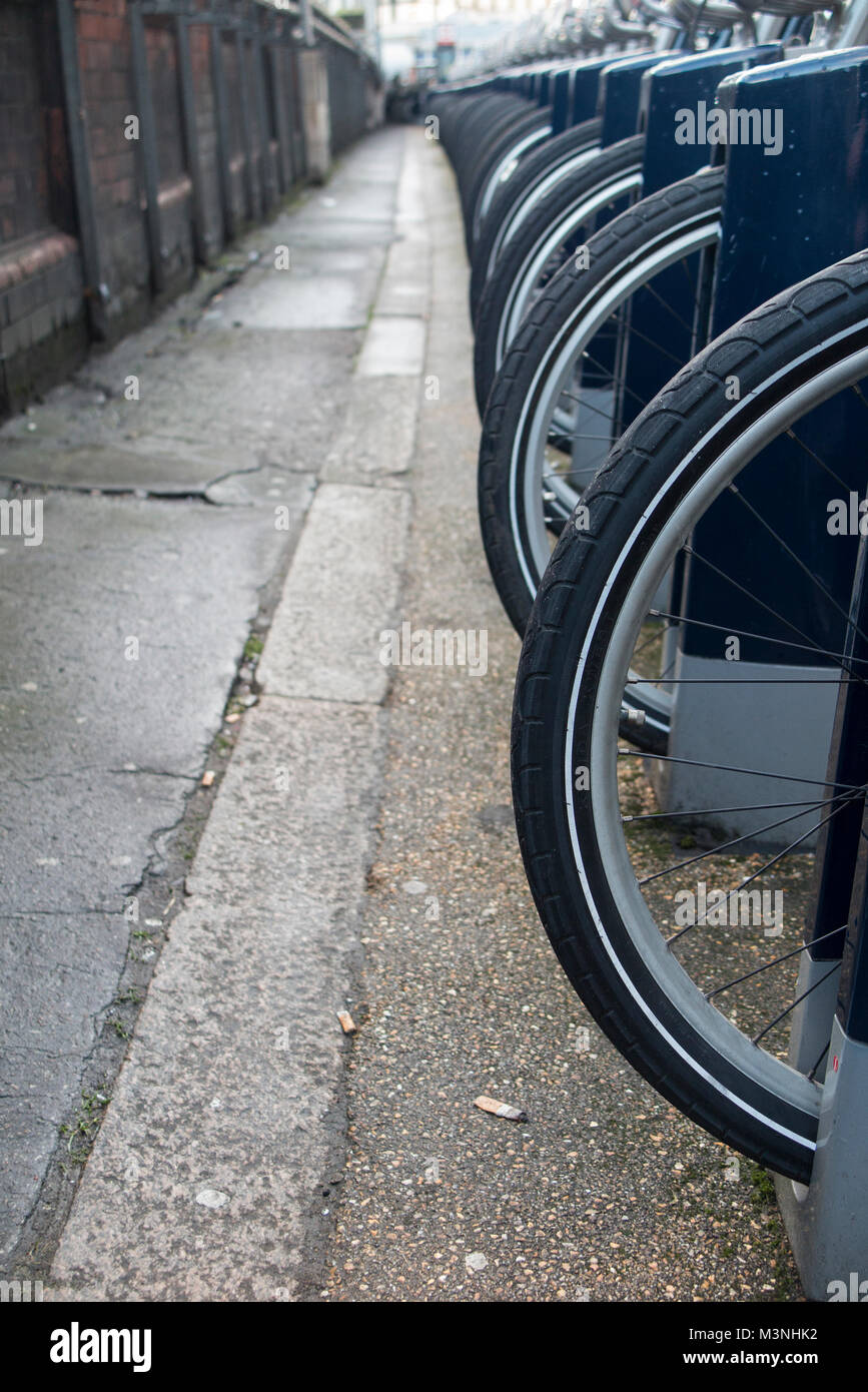 Many, many bike wheels lined up in London Stock Photo Alamy