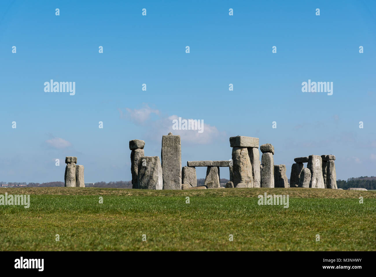 Stonehenge, Wiltshire - view across grass fields of the stone circles on a quiet day with no visitors - space for captioning Stock Photo