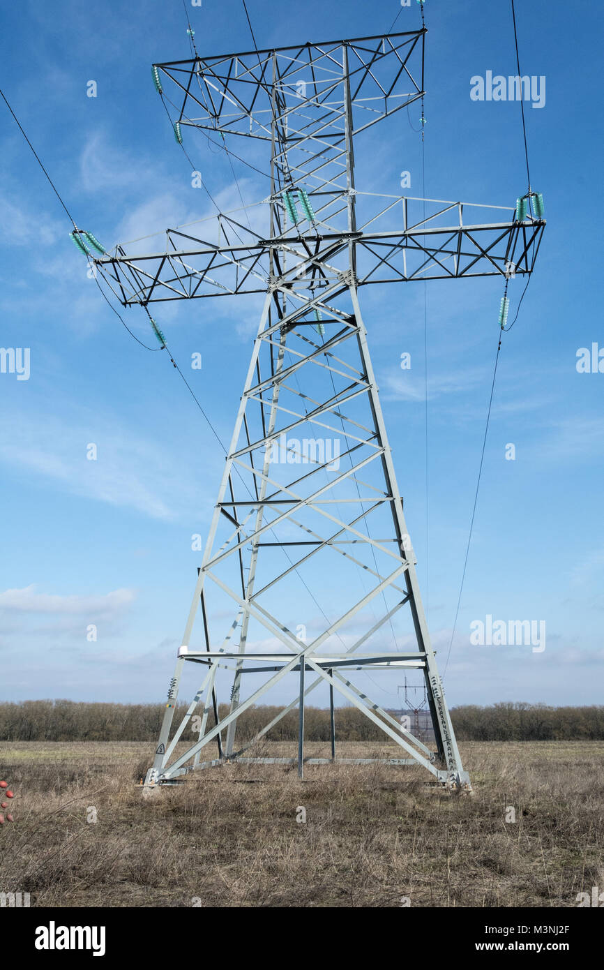 High voltage towers, under the blue sky white clouds at february Stock ...