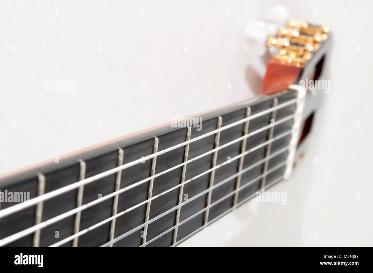Strings and head of a classical spanish guitar Stock Photo Alamy