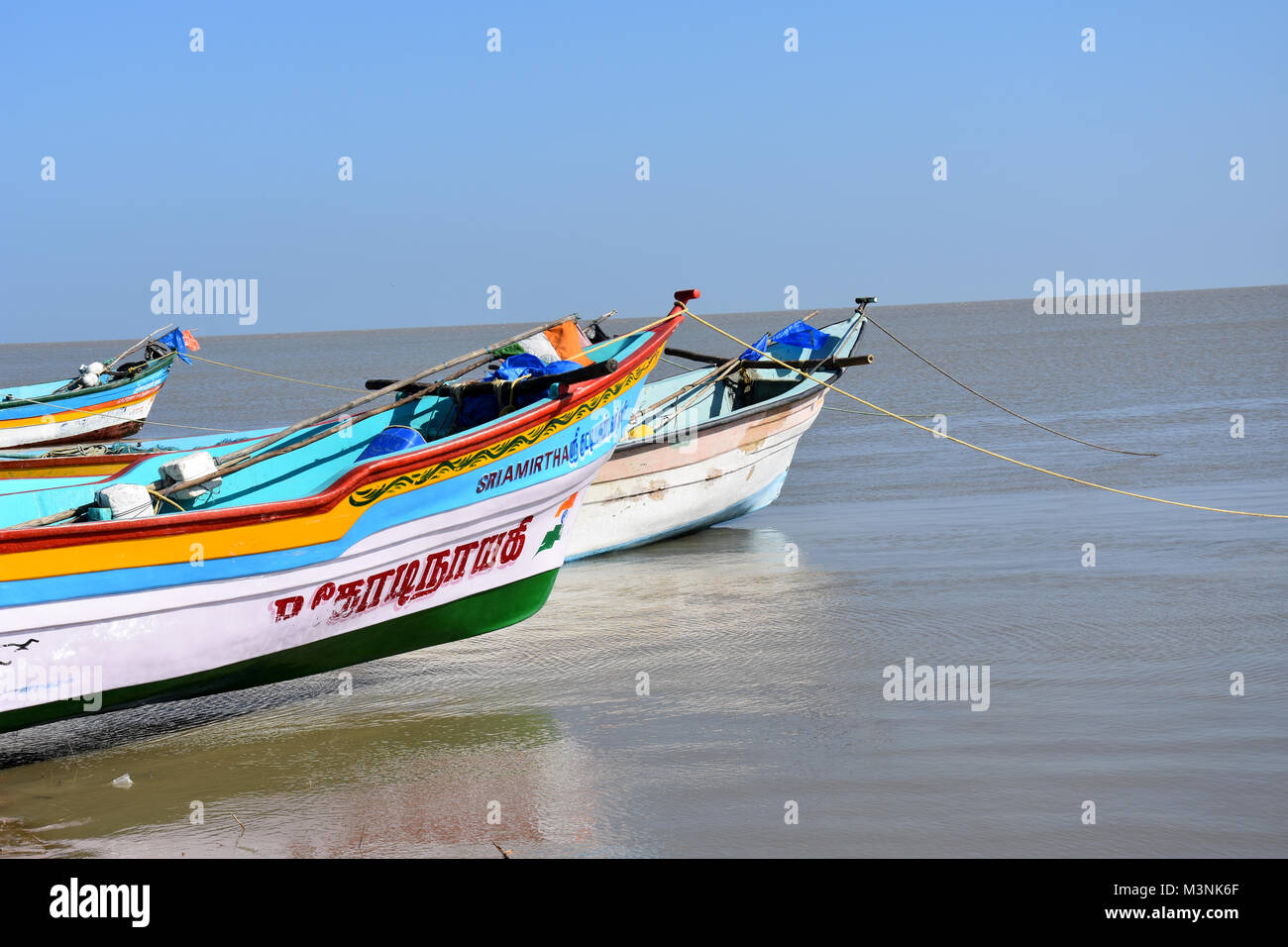 Fishing boats on a calm Sea Stock Photo - Alamy