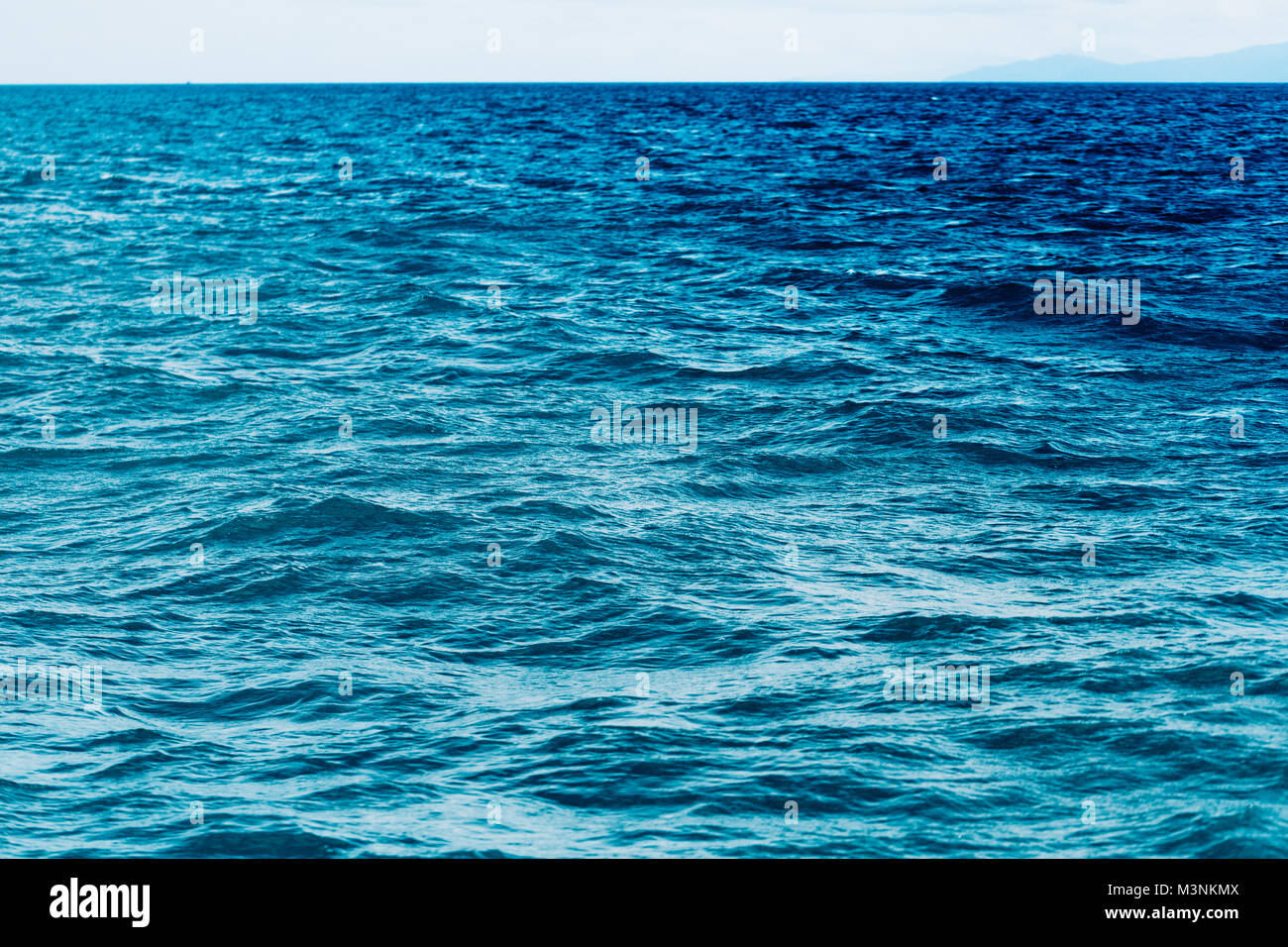 Bright Blue ocean with smooth wave background Stock Photo Alamy