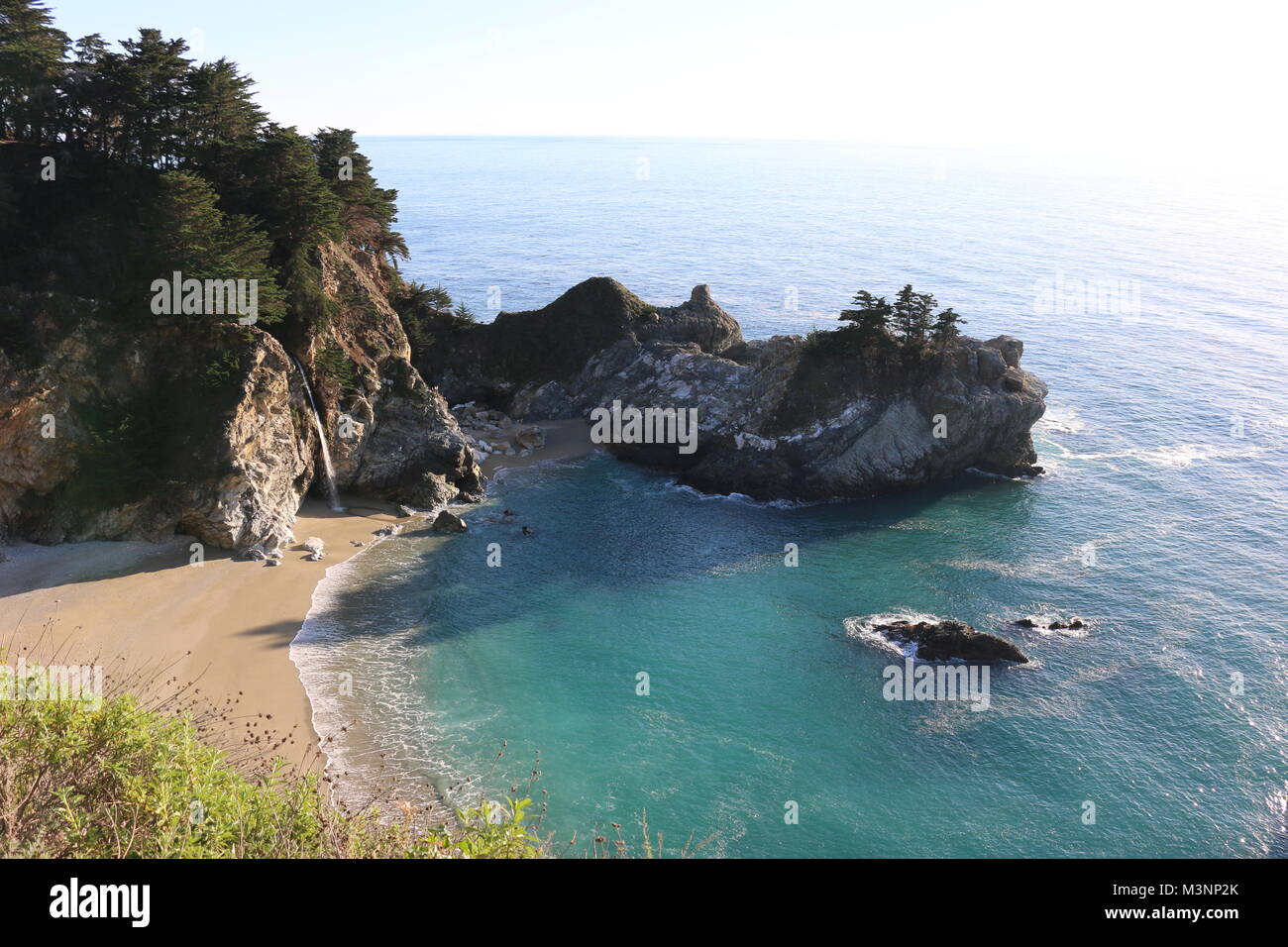 McWay Falls, a beautiful waterfall, plunges into the sand at Julia Pfeiffer Burns State Park, Big Sur, CA. Stock Photo