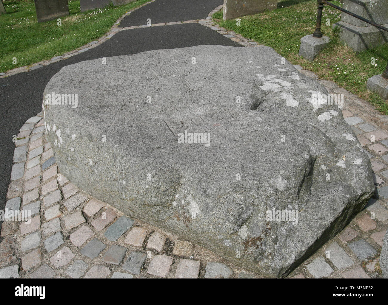 St Patrick's grave  - the reputed grave of Saint Patrick at Down Cathedral, Downpatrick, County Down, Northern Ireland. Stock Photo