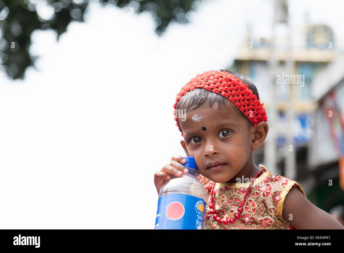 Dambulla Kandy road Sri Lanka Matale little girl big black eyes traditional culture tradition costume clothes Stock Photo