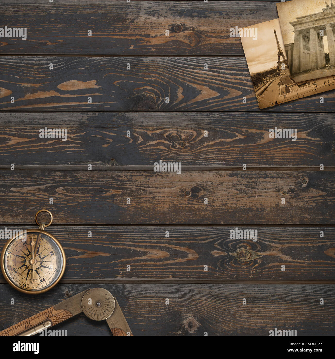 Old wood background with compass. Adventure and travel concept. Stock Photo