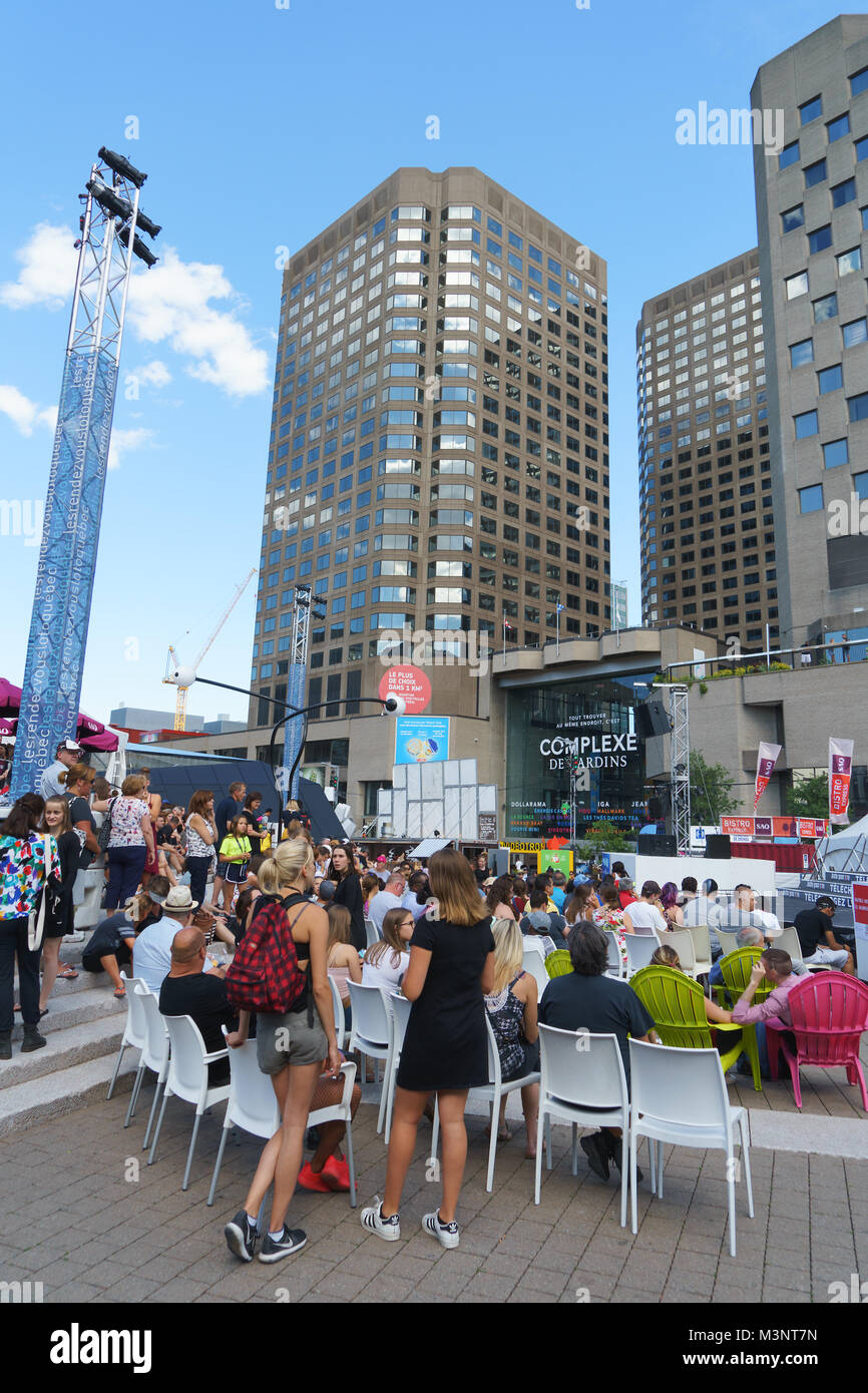 Audience waiting for an outdoor show to begin on Place des Festivals in Montreal, province of Quebec, Canada. Stock Photo