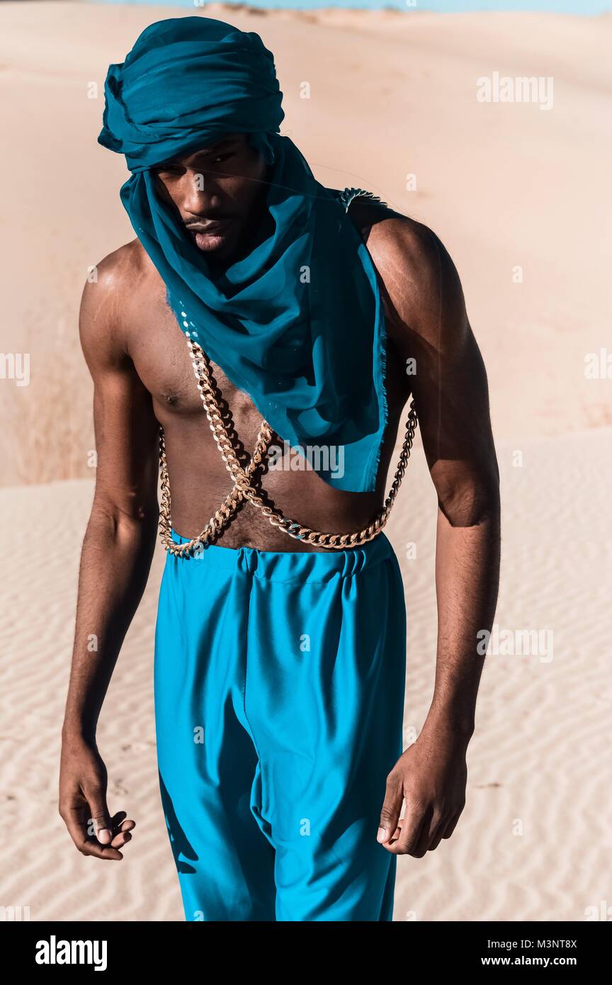 Full body portrait of a man in the desert sands Stock Photo Alamy