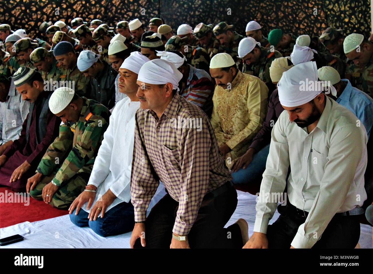Army men praying Jashn e Wular Festival, Kashmir, India, Asia Stock Photo