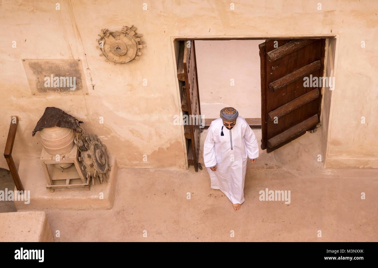 arab man in traditional omani outfit in an old castle Stock Photo