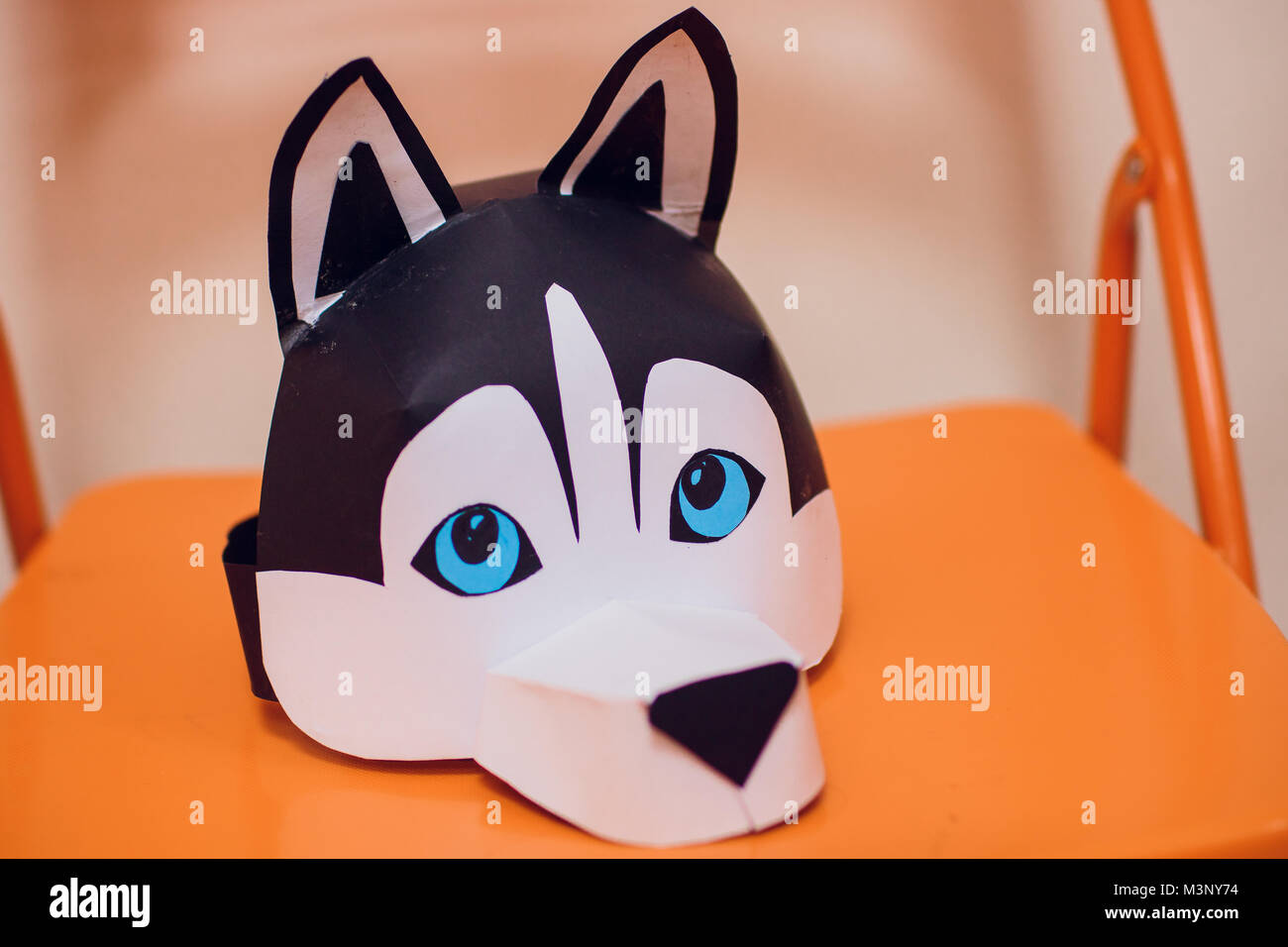 children make masks of husky dogs craft Stock Photo - Alamy