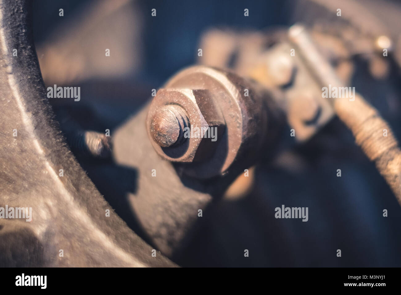 rusty screw and nut macro in rusted engine Stock Photo