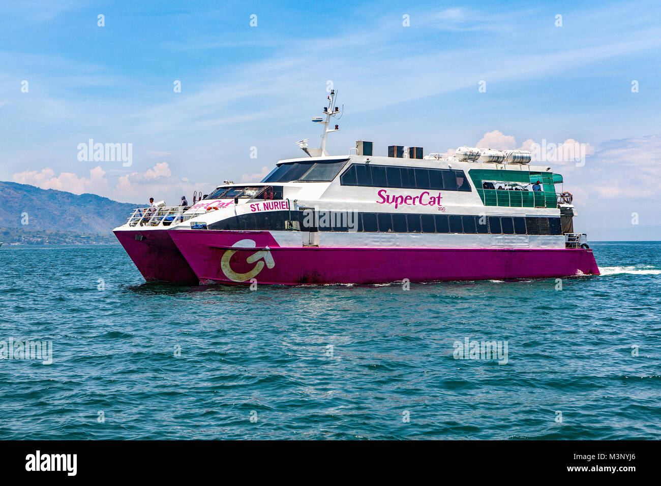 SuperCat, a catamaran type ferry boat, provides fast inter-island transportation from Luzon Island to Oriental Mindoro Island in the Philippines. Stock Photo