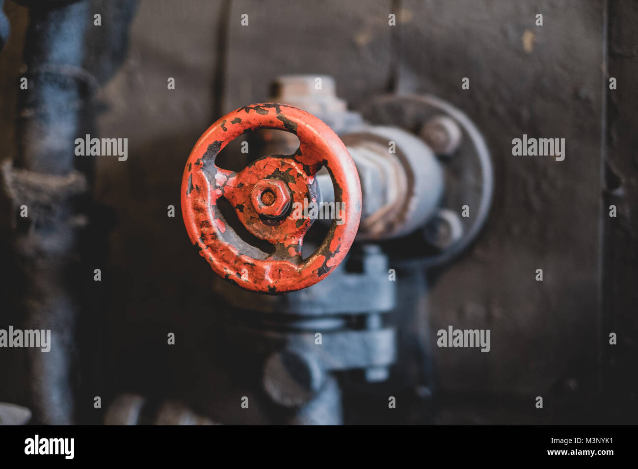 vintage red valve handle closeup - old  technology Stock Photo
