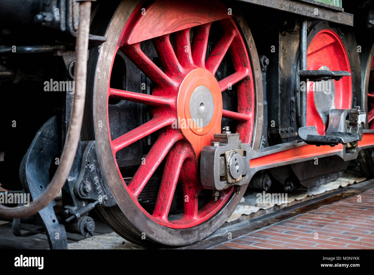 old steam locomotive wheel closeup - old transport technology - Stock Photo