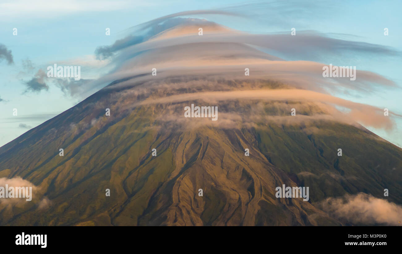 Mayon Volcano with the ventricular of clouds. TimeLapse in sunrise. Active stratovolcano in the province of Albay in Bicol Region, on the island of Luzon in the Philippines. Stock Photo