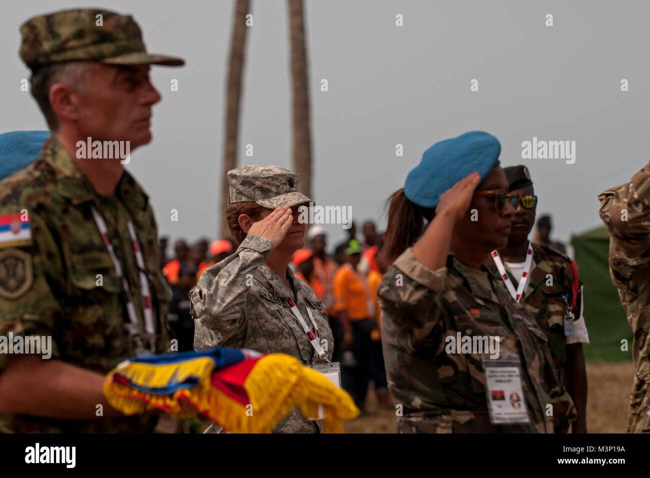 Lt. Col. Jill McLoughlin, a preventative medicine officer with the Ohio Army National Guard, represents the U.S. in the exchanging of flags during the closing ceremony for the PAMBALA 2017 exercise Dec. 14, 2017, in Bengo Province, Angola. Personnel from the Serbian Armed Forces and the Ohio National Guard exchanged flags with their host nation, the Republic of Angola, and remarks were given by representatives of each participating country on the success of the first-ever engagement. (Ohio National Guard photo by Staff Sgt. Wendy Kuhn) Historic PAMBALA 2017 draws to a close by Ohio National Gu Stock Photo