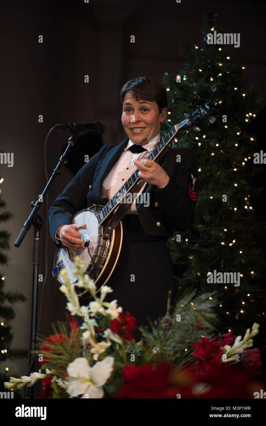 171216-N-VV903-1103 WASHINGTON (Dec. 16, 2017) Musician 1st Class Haley Stiltner  performs with the U.S. Navy Band during a holiday concert at DAR Constitution Hall in Washington. The Navy Band hosted thousands of people from the Washington area as well as hundreds of senior Navy and government officials during its three annual holiday concerts. (U.S. Navy photo by Musician 1st Class David Aspinwall/Released) 171216-N-VV903-1103 by United States Navy Band Stock Photo