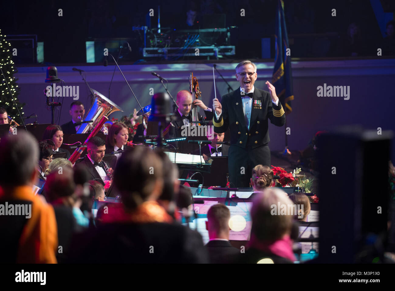 171216-N-VV903-1200 WASHINGTON (Dec. 16, 2017) Captain Kenneth Collins leads the  U.S. Navy Band during a holiday concert at DAR Constitution Hall in Washington. The Navy Band hosted thousands of people from the Washington area as well as hundreds of senior Navy and government officials during its three annual holiday concerts. (U.S. Navy photo by Musician 1st Class David Aspinwall/Released) 171216-N-VV903-1200 by United States Navy Band Stock Photo