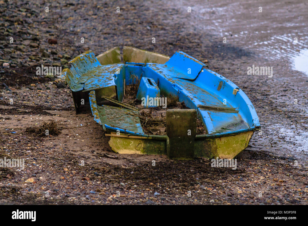 Broken abandoned small sailing boat wreck on the Exe Estuary, south Devon. Stock Photo