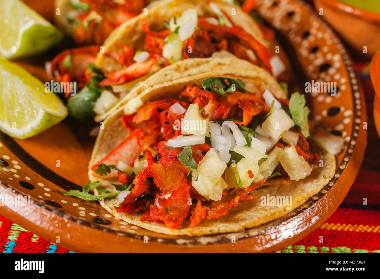 mexican tacos al pastor in mexico city spicy food, lime and sauce Stock
