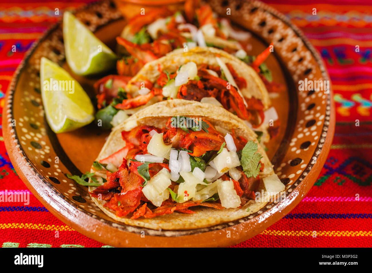mexican tacos al pastor in mexico city spicy food, lime and sauce Stock