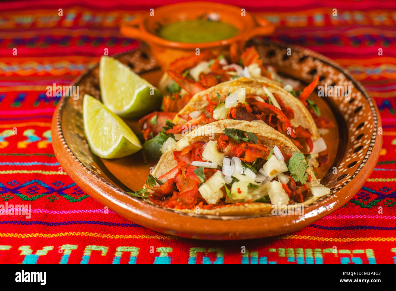 mexican tacos al pastor in mexico city spicy food, lime and sauce Stock