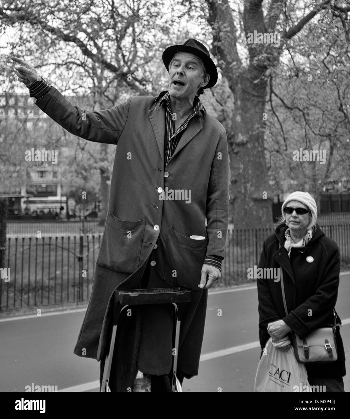 Black & White Photograph of a man standing on a podium at Speakers Corner, Hyde Park, London, England, UK. Credit: London Snapper Stock Photo