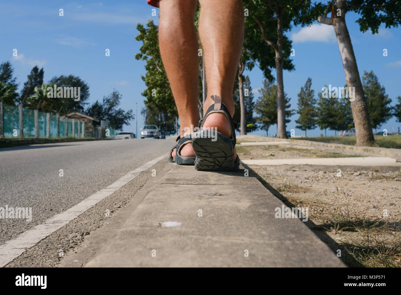 Young man hiking in tropical hi-res stock photography and images - Alamy