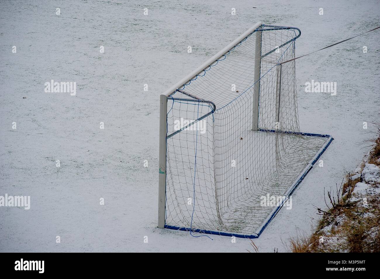 soccer field covered with snow Stock Photo