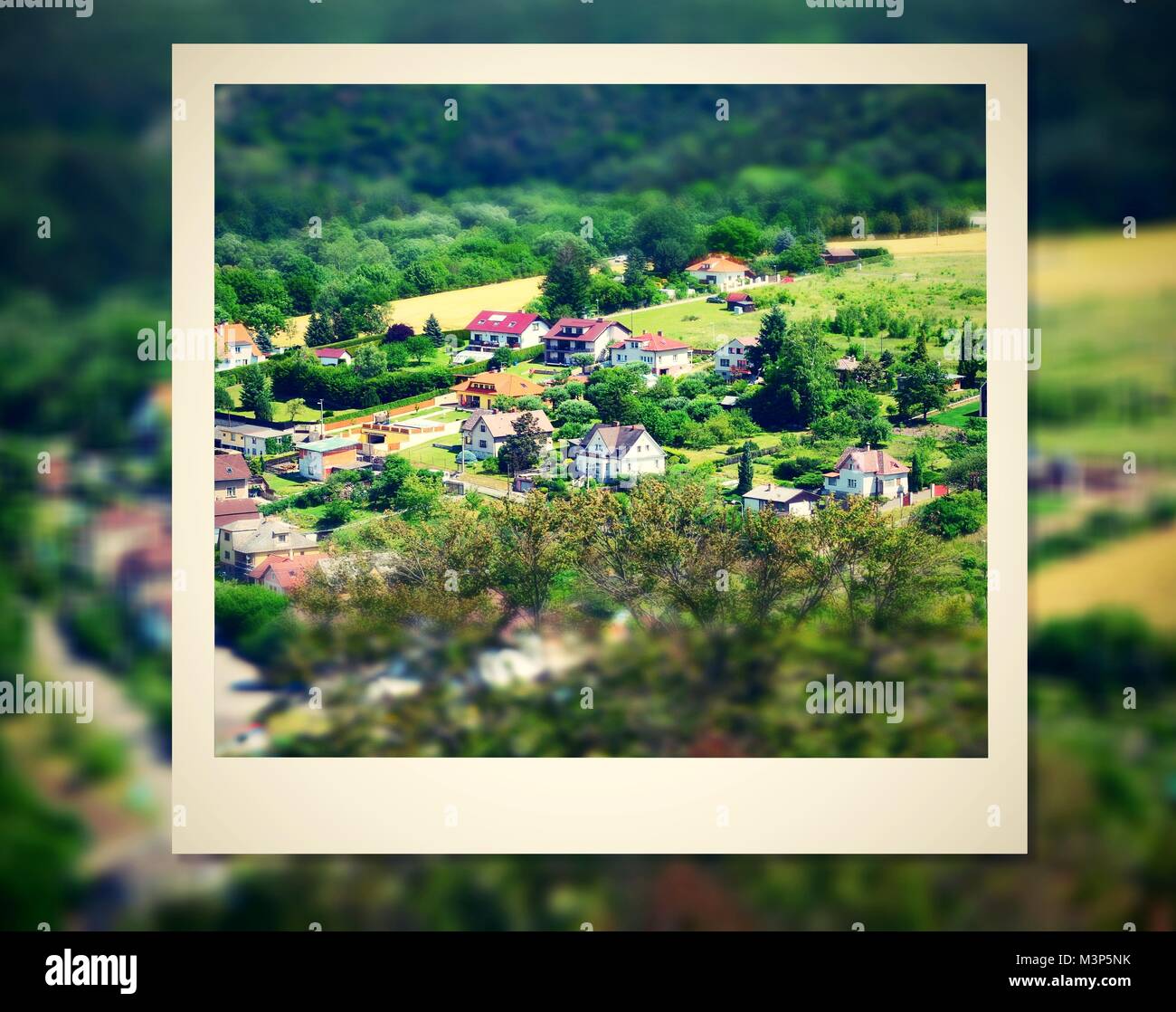 Instant photo frame with aerial view on a village Stock Photo Alamy