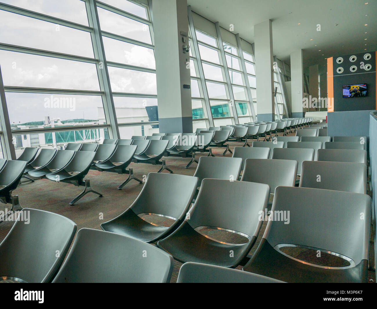 Airport Waiting Chair Area with Jet Bridge View. Large Airport Waiting