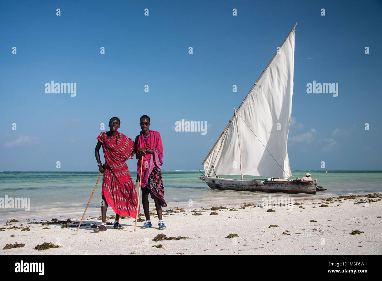 KIWENGWA, ZANZIBAR - DEC 27, 2017: Portrait of masai men in traditional clothes posing on the beach, Kiwengwa, Zanzibar Stock Photo