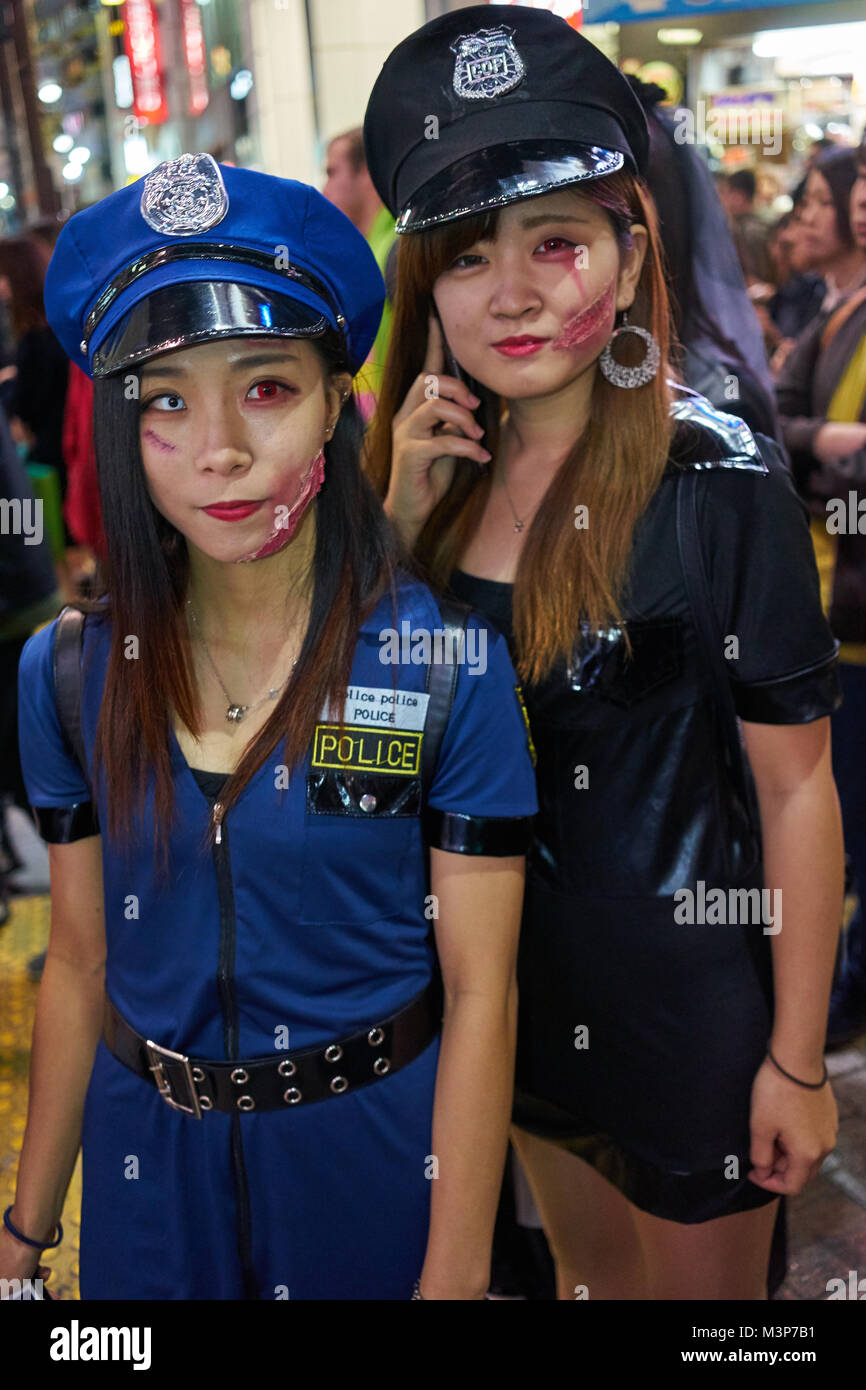 Young Japanese girls dressed as police officers at the Halloween  celebrations in Shibuya, Tokyo Stock Photo - Alamy