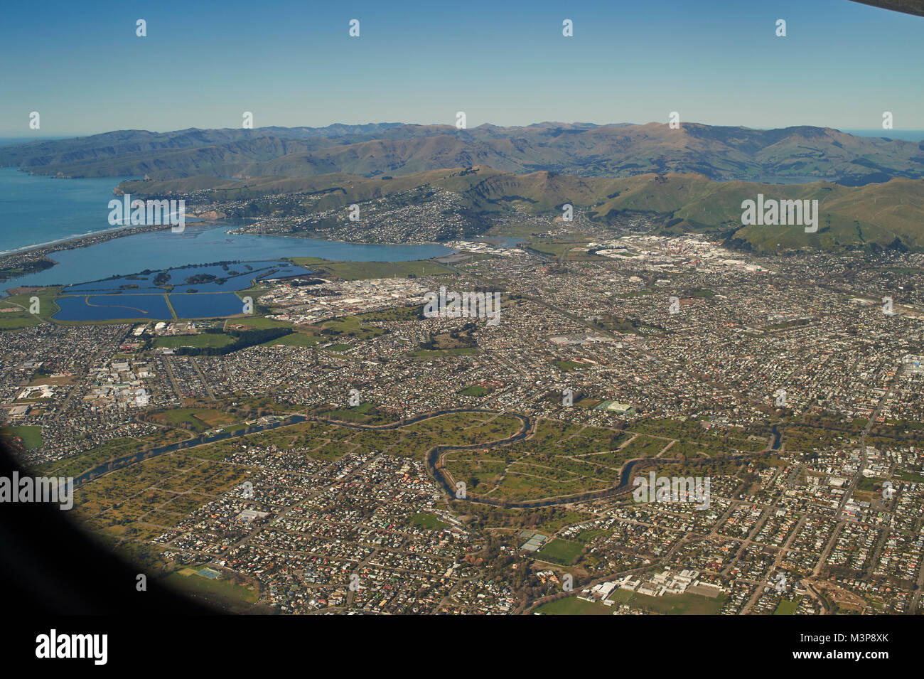 Aerial view over Christchurch, Canterbury as plane comes in to land Stock Photo