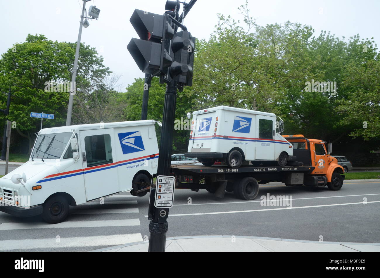 two USPS postal service delivery vans being recovered in newport rhode