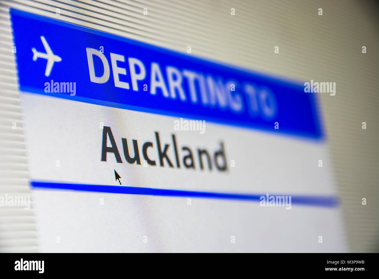 Computer screen close-up of status of flight departing to Auckland, New Zealand Stock Photo