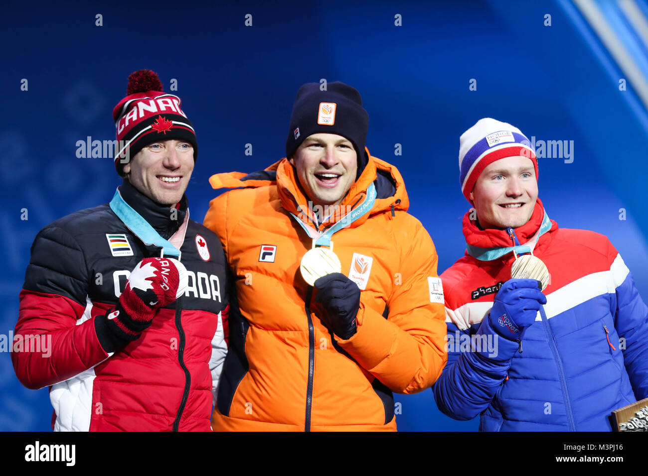(180212) -- PYEONGCHANG, Feb. 12, 2018 (Xinhua) -- Champion Sven Kramer (C) from the Netherlands, second-placed Ted-Jan Bloemen (L) from Canada and third-placed Sverre Lunde Pedersen from Norway pose for photos during the medal ceremony for men's 5000m event of speed skating at 2018 PyeongChang Winter Olympic Games at the Medal Plaza in PyeongChang, South Korea, on Feb. 12, 2018. (Xinhua/Wu Zhuang) Stock Photo