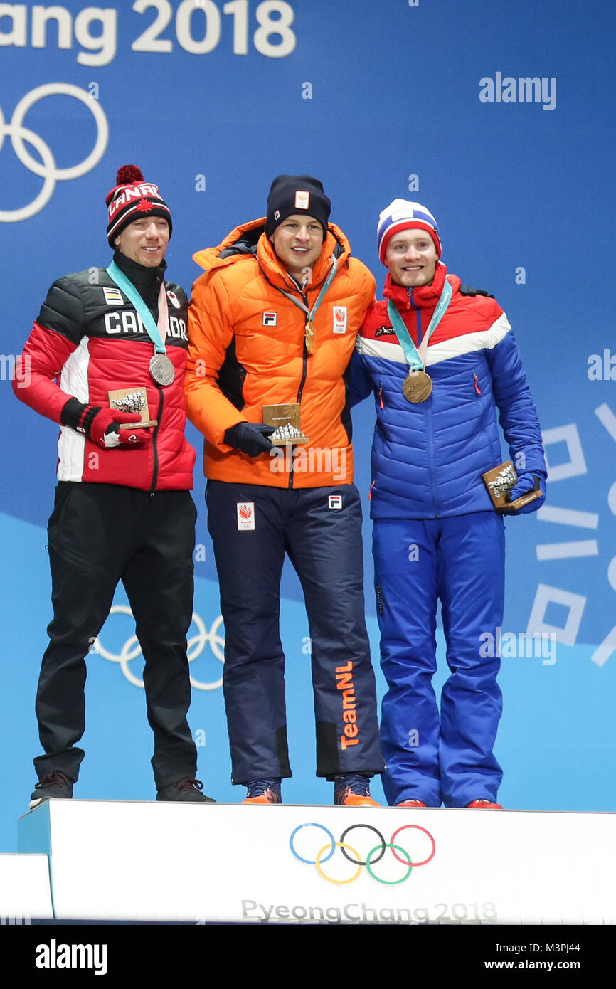 (180212) -- PYEONGCHANG, Feb. 12, 2018 (Xinhua) -- Champion Sven Kramer (C) from the Netherlands, second-placed Ted-Jan Bloemen (L) from Canada and third-placed Sverre Lunde Pedersen from Norway pose for photos during medal ceremony for men's 5000m event of speed skating at 2018 PyeongChang Winter Olympic Games at the Medal Plaza in PyeongChang, South Korea, on Feb. 12, 2018. (Xinhua/Wu Zhuang) Stock Photo