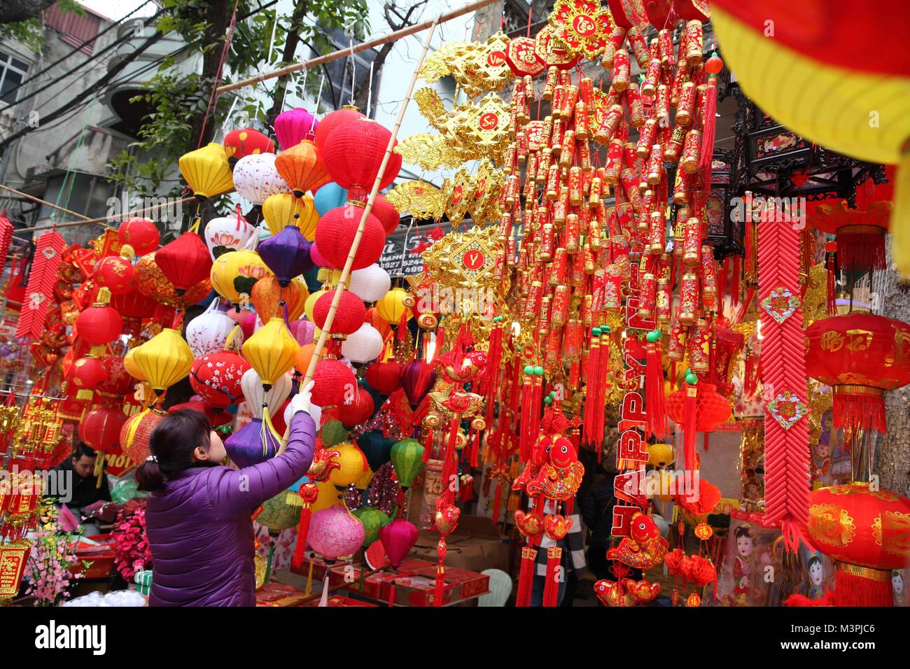 Hanoi Vietnam 12th Feb 18 A Vendor Arranges Lunar New Year Decorations At A Stall In Hanoi Capital Of Vietnam Feb 12 18 The Lunar New Year Festival Also Called Tet In