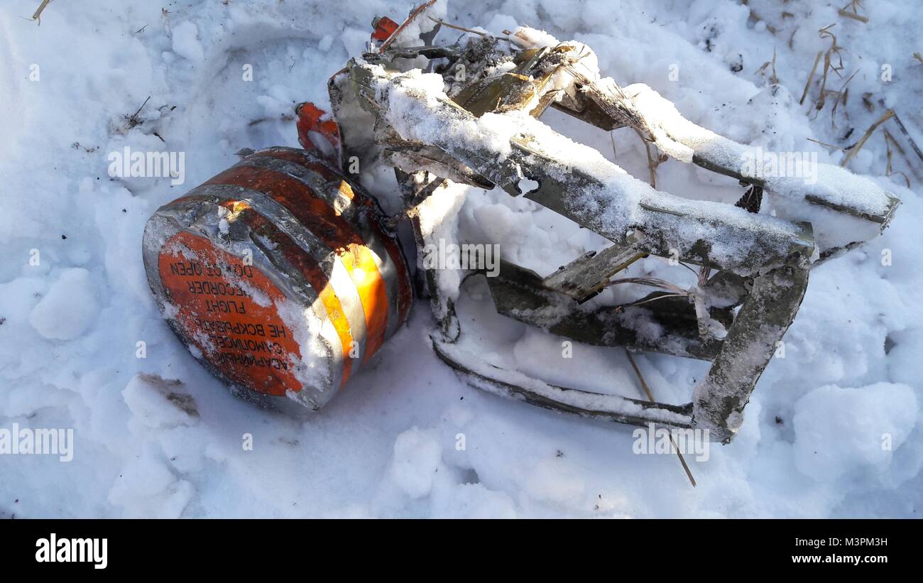 Moscow Region, Russia. February 12, 2018. Rescue workers have presumably found the flight data recorder at the crash site of the An-148 passenger plane in the Moscow Region during the search operation. The Interstate Aviation Committee (IAC) is working to confirm and identify the device. Photo: The Interstate Aviation Committee (IAC) Stock Photo