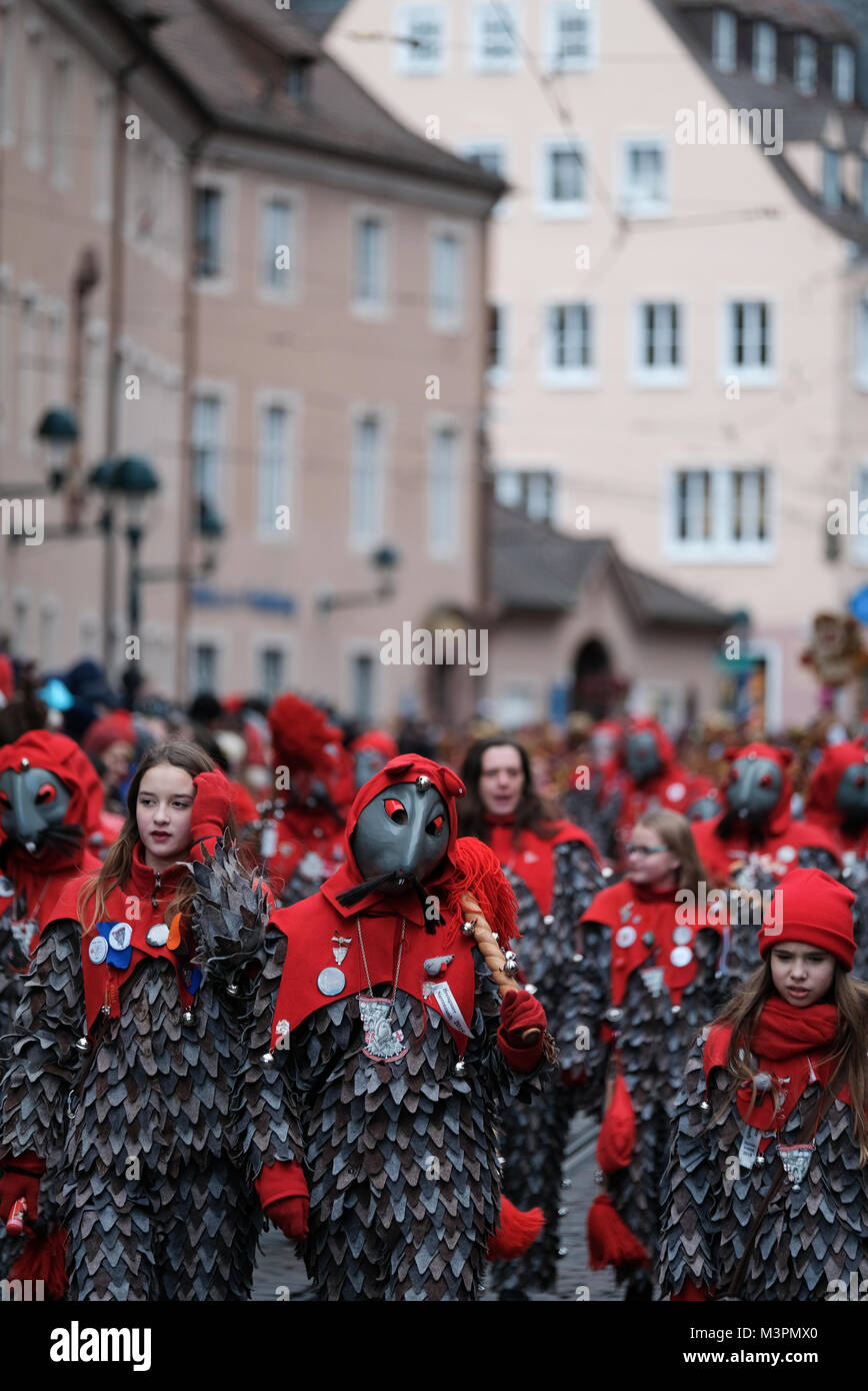 Freiburg, Germany. 12th February, 2018. Participants wearing traditional masks and costumes during the Rose Monday carnival parade in Freiburg, Germany on February 12, 2018. Credit: Miroslav Dakov/Alamy Live News Stock Photo