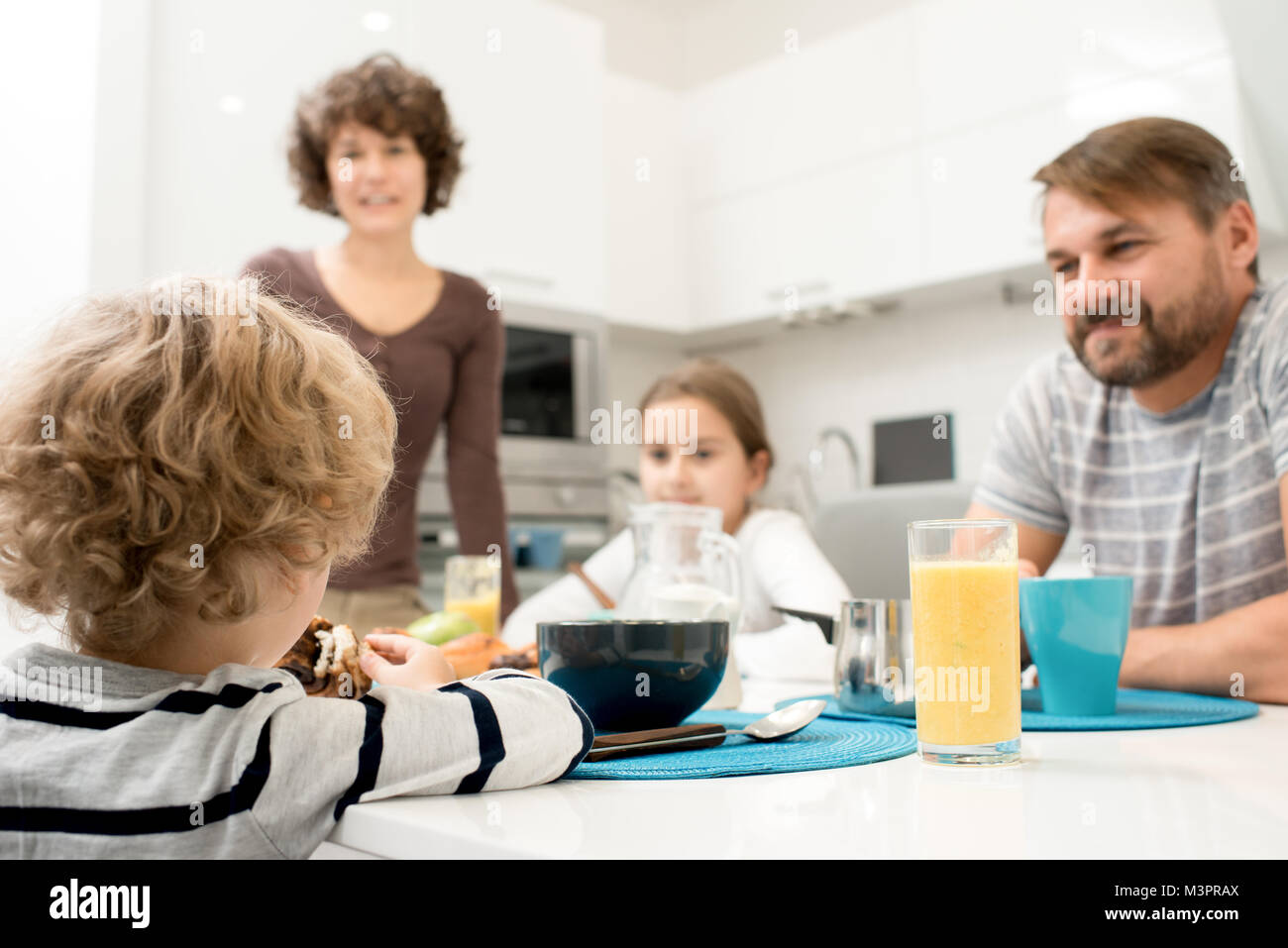 Young Family in Kitchen Stock Photo Alamy
