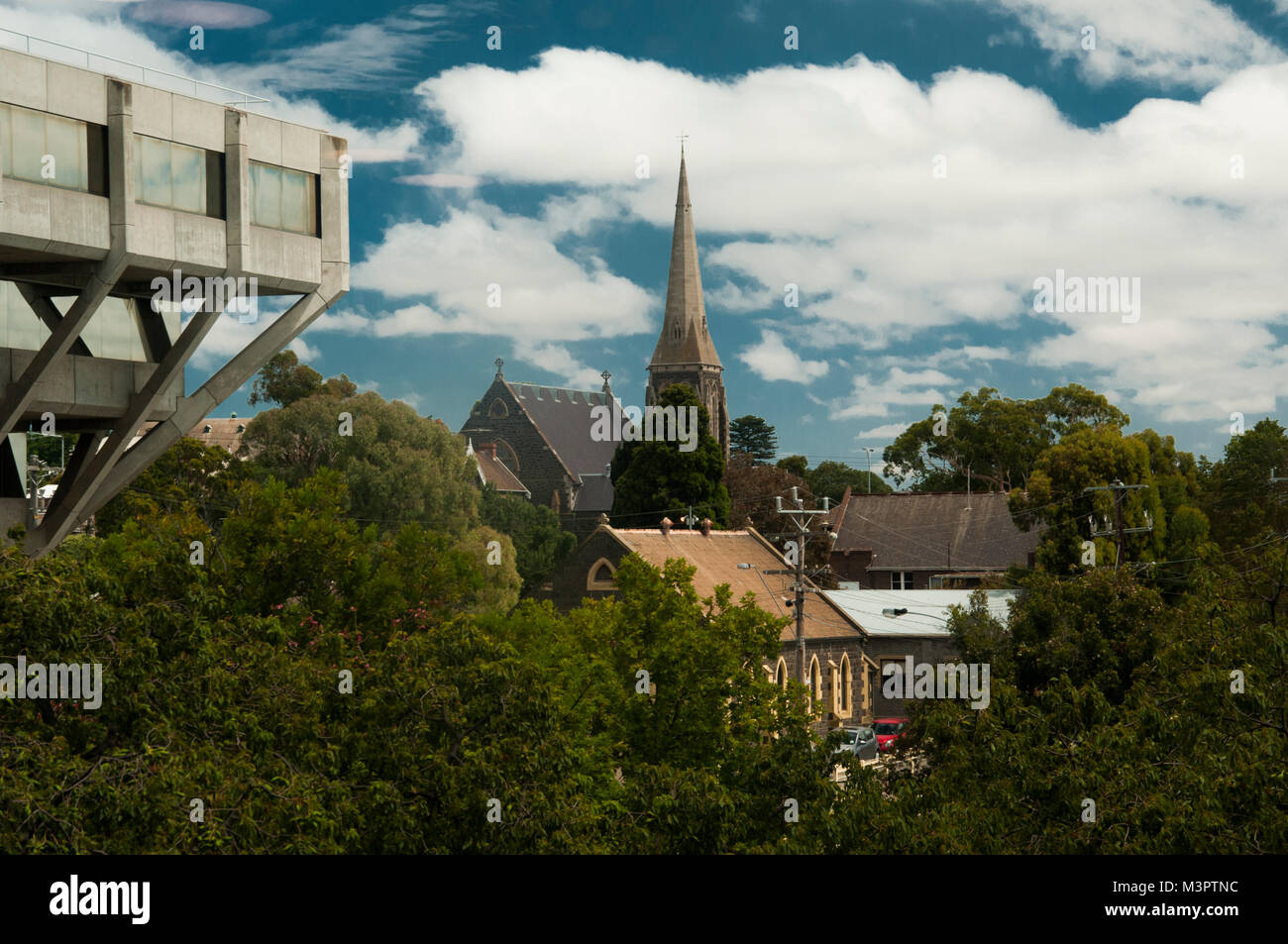 Historic 19th-century churches seen beyond the State Government Offices building, Geelong, Victoria, Australia Stock Photo