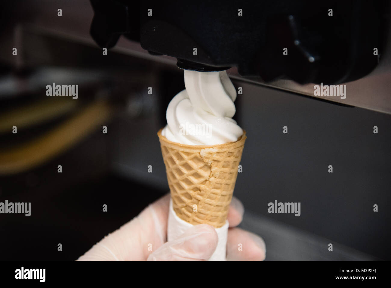 Industrial preparation of creamy ice cream on the kitchen Stock Photo