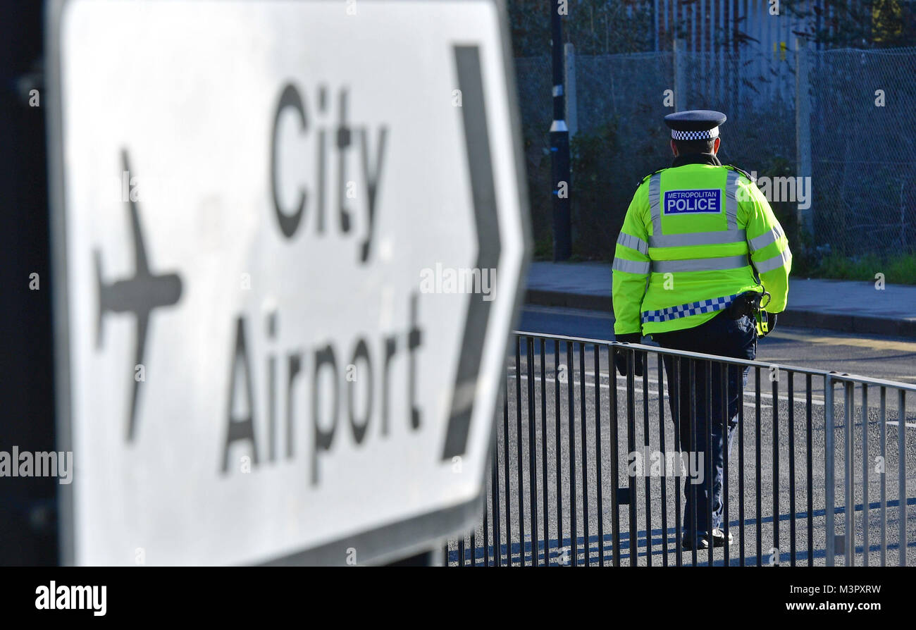 A Metropolitan Police officer close to London City Airport which has been closed after the discovery of an unexploded Second World War bomb. Stock Photo