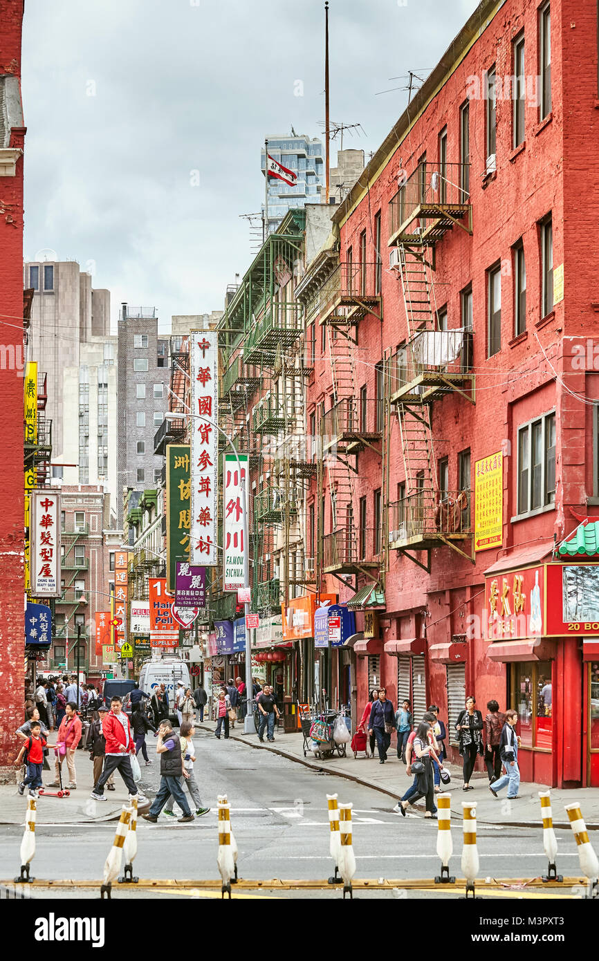 New York, USA - May 27, 2017: Bustling street in the Manhattan Chinatown, one of the oldest Chinese ethnic enclaves. Stock Photo