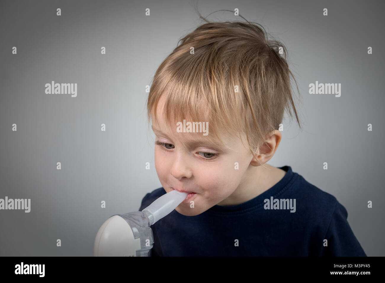 Little boy takeing inhalation for respiratory didease Stock Photo Alamy