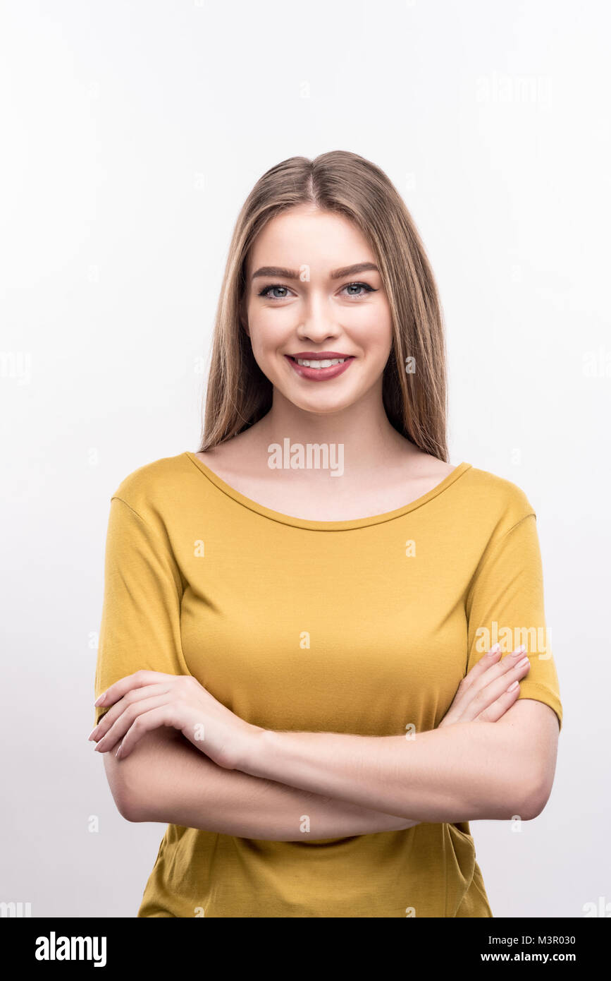 Beautiful woman folding her arms across her chest Stock Photo